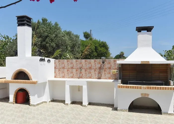Flora's And Pool In Syros Liaropá